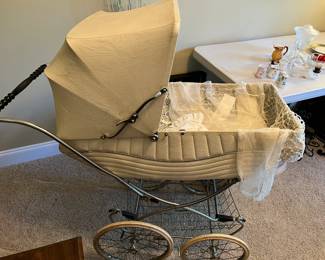 #16	Antique Baby Carriage - England - w/bottom Shelf (comes off for bassinet	 $125.00 			
