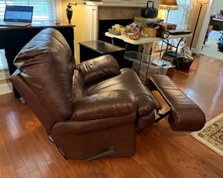 #55	Oversize Brown Pleather Rocker Recliner	 $100.00 			
