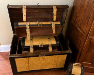 #69	4 Wood Trunks covered w/leather - 30x18x19	 $75.00 			
