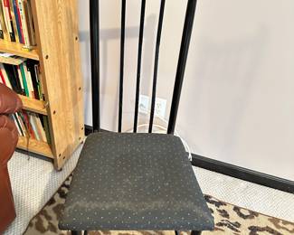 black chair, leopard print rug