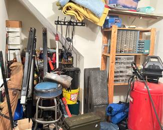 misc garage items, stool, ammo crate, air compressor, shelving, lift