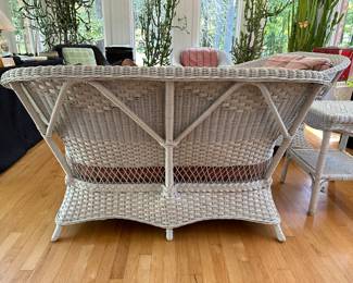 RF1 - $350 Each. Henry Link Wicker Loveseat. (2 available) Very Good vintage condition. Measures 59" at the widest point x 34" Floor to top of Back x 35" deep. (Cushions are sun faded from all of the windows and skylights)