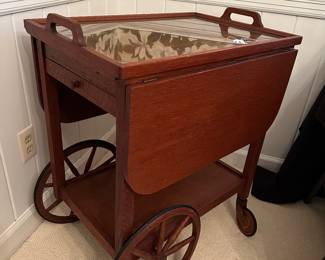 RF9 - $125. Wooden tea cart with glass tray top. Measures 17" wide x 25" long x 31" tall. 