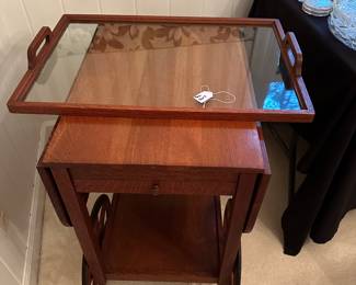 RF9 - $125. Wooden tea cart with glass tray top. Measures 17" wide x 25" long x 31" tall. 