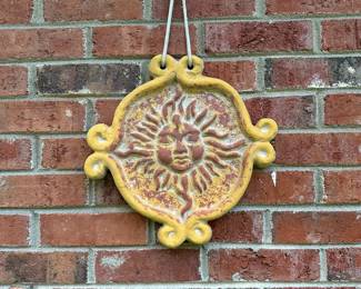 RP11 - $25. Terra Cotta Sun Wall Hanging. Measures 13" across. 