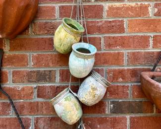 RP25 - $35. Hangs 33" long 5 small colorful Terra Cotta Pots. 