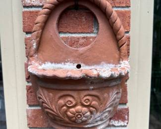RP54 - $30. Terra Cotta Wall Planter. Measures 11" wide x 14" tall. 