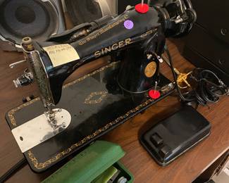 $100. Singer Sewing Machine model 221. Has foot pedal. Works!