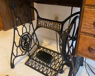 RF24 - $150. Singer Sewing Machine with Treadle machine base. (This machine is electric)