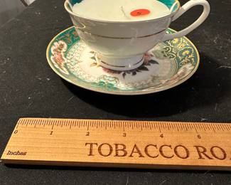 RD62 - $5. Tea Cup Candle. 