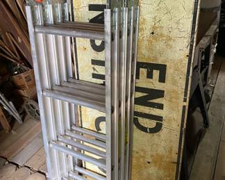 Folding Ladder and Old Sign