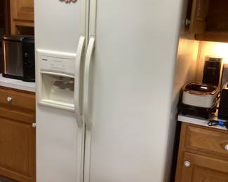 Kenmore refrigerator with ice and water dispenser in the door