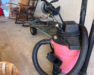 Shop vacuum, miter saw, garden cart, rockers, and lots of storage totes