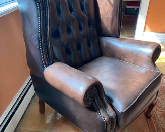 Leather tufted wing back chair from England
