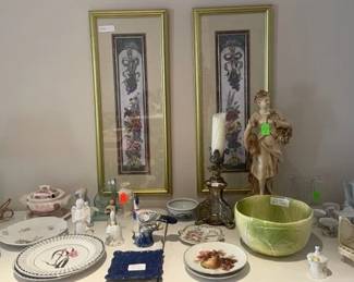 Living room table against wall and under the two pics