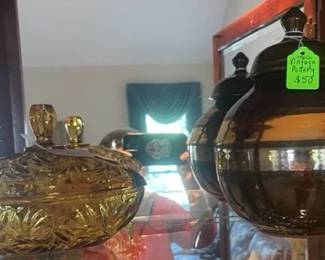 pottery and carnival glass candy dish inside living room cabinet