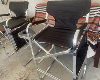 two black director chairs and futon in the background