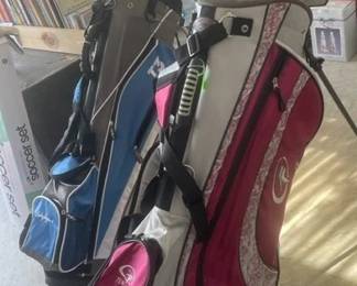 two sets of golf clubs garage