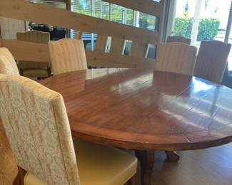 Fremarc Design 25" solid wood pedestal table and 8&nbsp;leather seated high back chairs.&nbsp;
