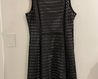 Now $50. Was $100. Karl Langerfeld black dress with laser cut and sheath.