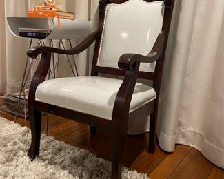Now $300. Was $350. Antique chair recovered in white patent leather . 25"wx22"dx38"h. Seat height is 17" and depth is 18”.