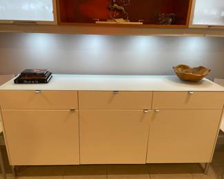 Now $600. Was $1,200. Three drawer, 3 door modern sideboard. 74"Lx17"dx34"h. Feet and tabs have a matt gray finish.
