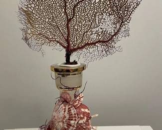 Now $75. Was $150. Vintage carafe with rings of gilt and floral etching, encrusted with shells. An 8” width and depth dimensions take into account the space needed for the coral fan, whereas the bottom carafe diameter is 4”