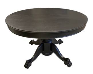 Antique 4’ Round Raven black wood claw foot table with 3 additional leaves.