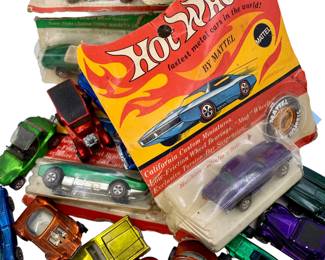 1960s NOS and used Hot Wheels Redline cars, some with collectors buttons and factory packaging