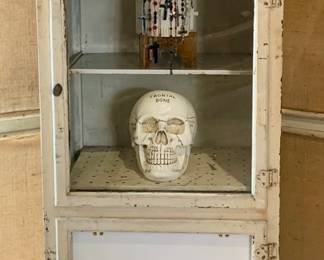 Antique wooden Medical Cabinet with porcelain swing door, shelves and interior waste bin, many Catholic rosaries, vintage metal Ambulance plaque