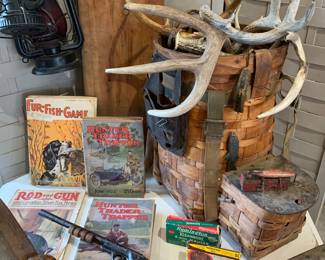 Early hunting/trapper magazines, antique trapper backpack basket, loads of skinning boards and hunting accoutrements, early lanterns 