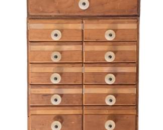 3 Separate miniature 14” tall multi drawer cabinets shown stacked on top of each other, crafted of wood with composite knobs and label guards.