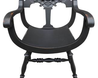 Gothic Antique Raven wood armchair with carved face detail. 