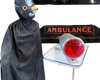 Pair Art Deco 41” Metal Ambulance Funeral Home automobile Panels, Creepy vintage Halloween bird costume with pantsuit, cape/sheath and mask, porcelain funeral home medical table, early Signal Enterprises Inc. ambulance siren beacon with ruby lenses at each end. 