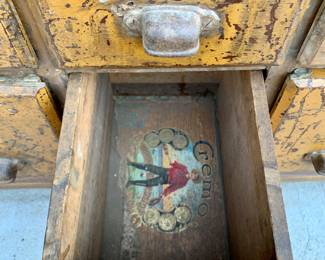 Early Cigar box Folk Art drawer repairs to this 49 drawer General Store Cabinet.