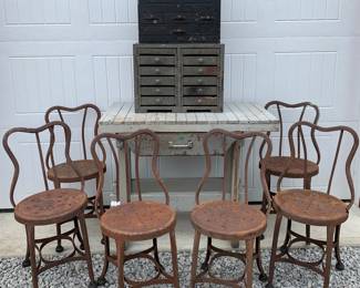 Early Metal banjo back pub chairs, smoke gray wood industrial work bench, assorted antique and vintage multi drawers and carved detail wooden tool box 