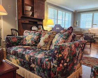 Floral Loveseat with fringe.