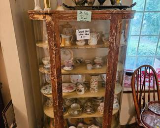 $125 Curved Glass cabinet, teacup $6 ea
