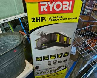 $125 New in box, 2HP Ryobi battery back up garage door opener