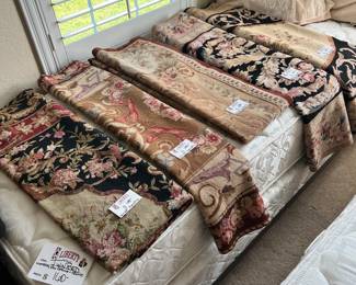 There are MANY hand sewn tapestries. Ranging in price. The most expensive was $100 so they will be $50 or less on Wed. 