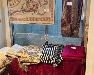 There are MANY hand sewn tapestries. Ranging in price. The most expensive was $100 so they will be $50 or less on Wed. 
