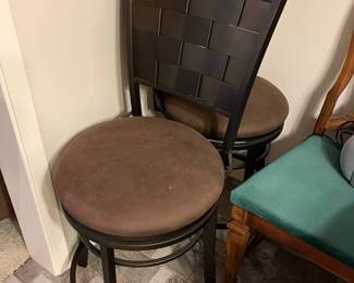 A pair of swivel iron stools