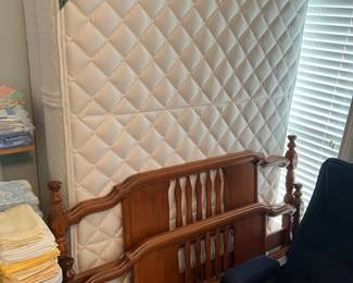 Matching queen-size bed and a mattress set