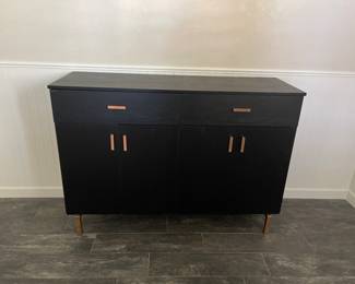 Black cabinet with gold handles