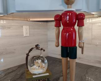 Rare Disney Pinocchio snow globe-illuminates. Wooden Italian jointed Pinocchio