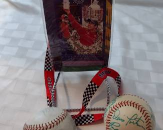 Signed baseballs. Ticket from Indie 500. More collectibles not pictured