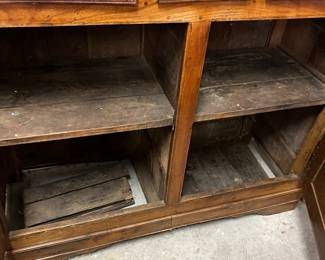 interior view of the lower shelves.  as found bottom shelf needs repair.