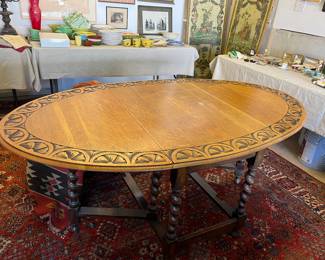 $220 Drop leaf table 68"oval x 41"w x 28.5"high.  When each leaf is down the table is 24"wide.   Gate legs hold it up.  As found spot on surface shown in the next photo.  
