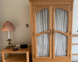 $220 Armoire with chicken wire and drapes plus two bedside tables.  Davis Cabinet Company three piece set for sale.  Solid wood, vintage pieces.  Armoire is 40.5"w x 21.5"d x 70"h, bedside tables in the next photos.
