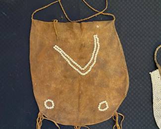 hide and bead pouch for sale during in-person shopping